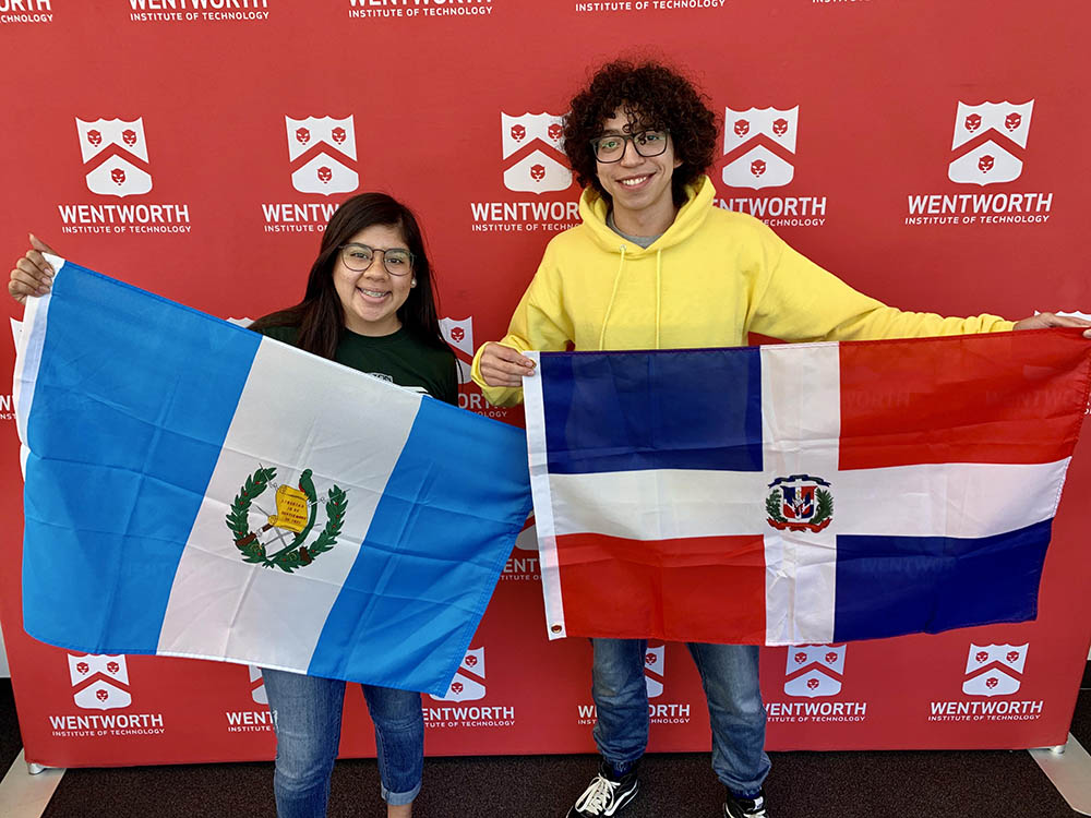 International students showing off their home country flags