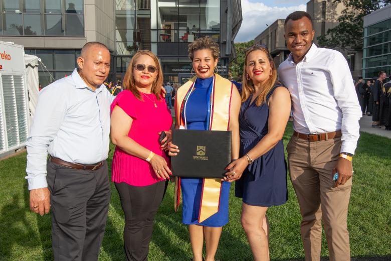 family of five celebrating a graduation